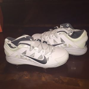 White Nike women's metal cleats